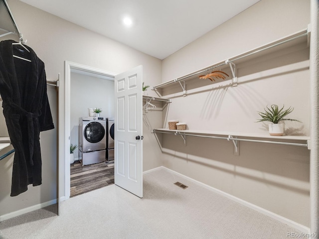 16448 E 111th Pl, Commerce City, CO 80022 - spacious closet featuring washing machine and dryer and carpet flooring