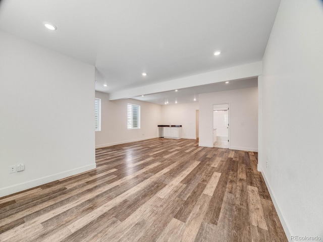 16448 E 111th Pl, Commerce City, CO 80022 - unfurnished living room featuring wood finished floors, baseboards, and recessed lighting