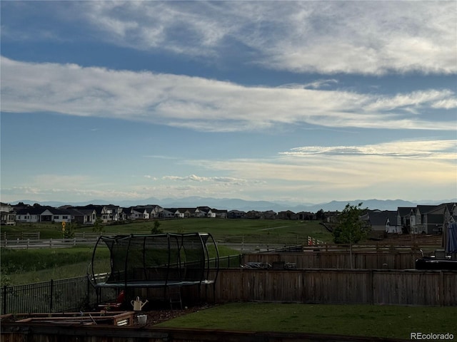 16448 E 111th Pl, Commerce City, CO 80022 - view of yard with a trampoline and a residential view