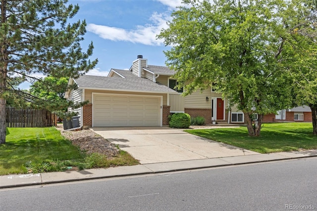 1245 Ceres Dr, Lafayette, CO 80026 - obstructed view of property featuring brick siding, a garage, driveway, a chimney, and entry steps
