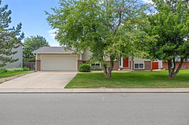 1245 Ceres Dr, Lafayette, CO 80026 - obstructed view of property with brick siding, driveway, an attached garage, a front yard, and entry steps