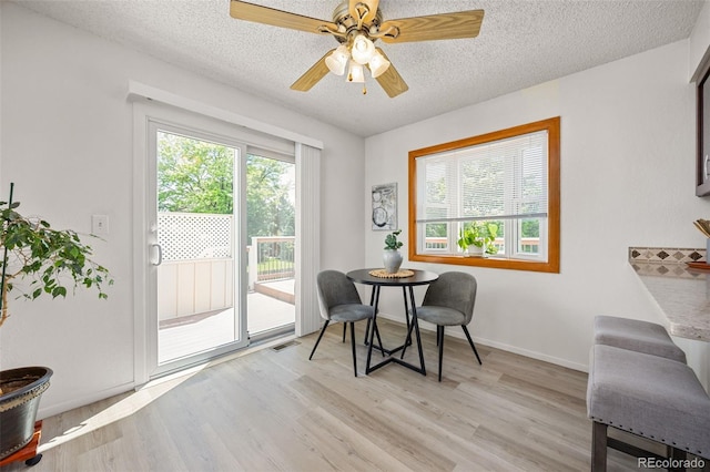1245 Ceres Dr, Lafayette, CO 80026 - sitting room featuring a textured ceiling, light wood-style flooring, and ceiling fan