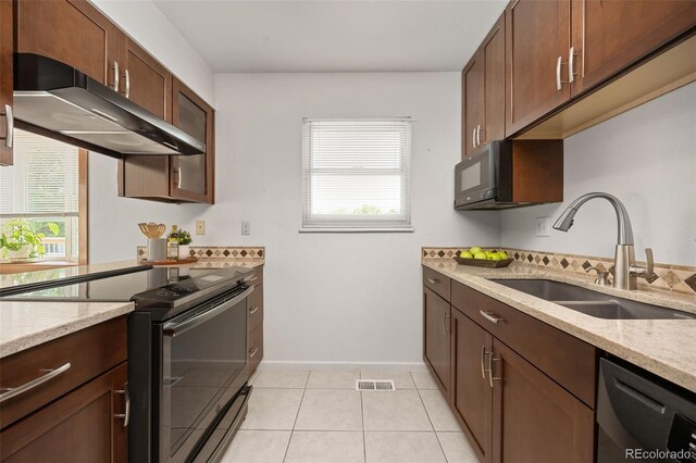 1245 Ceres Dr, Lafayette, CO 80026 - kitchen featuring black electric range oven, dishwasher, a sink, under cabinet range hood, and plenty of natural light
