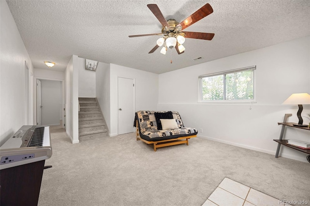1245 Ceres Dr, Lafayette, CO 80026 - sitting room with a textured ceiling, stairs, carpet flooring, ceiling fan, and baseboards