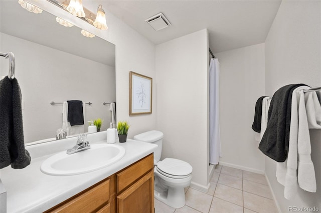1245 Ceres Dr, Lafayette, CO 80026 - bathroom featuring toilet, tile patterned flooring, vanity, and a shower with curtain