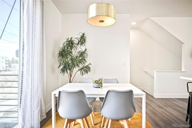 dining space featuring recessed lighting, wood finished floors, and baseboards