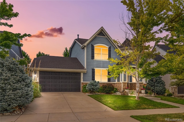 16207 Cadland Ct, Parker, CO 80134 - view of front of property featuring a garage, driveway, and a yard