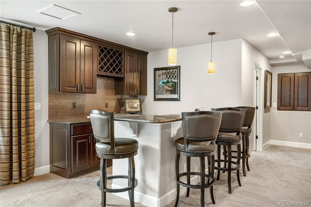 16207 Cadland Ct, Parker, CO 80134 - indoor bar with light colored carpet, tasteful backsplash, recessed lighting, and decorative light fixtures