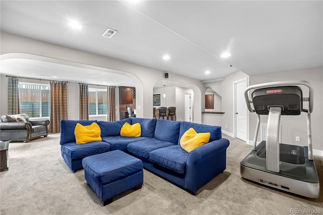 16207 Cadland Ct, Parker, CO 80134 - living room with arched walkways, carpet flooring, and recessed lighting