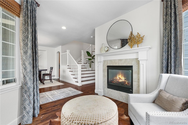 16207 Cadland Ct, Parker, CO 80134 - sitting room with stairway, a tile fireplace, wood finished floors, and recessed lighting