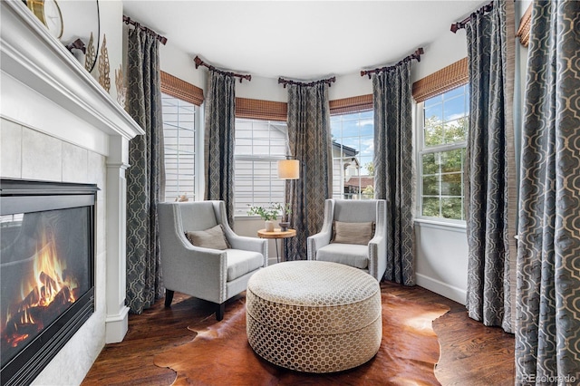 16207 Cadland Ct, Parker, CO 80134 - living area featuring a tiled fireplace and wood finished floors