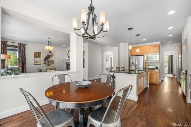 16207 Cadland Ct, Parker, CO 80134 - dining area with a chandelier, dark wood finished floors, and recessed lighting