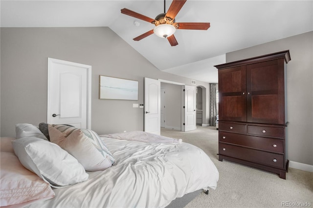 16207 Cadland Ct, Parker, CO 80134 - bedroom with lofted ceiling, light carpet, arched walkways, and ceiling fan