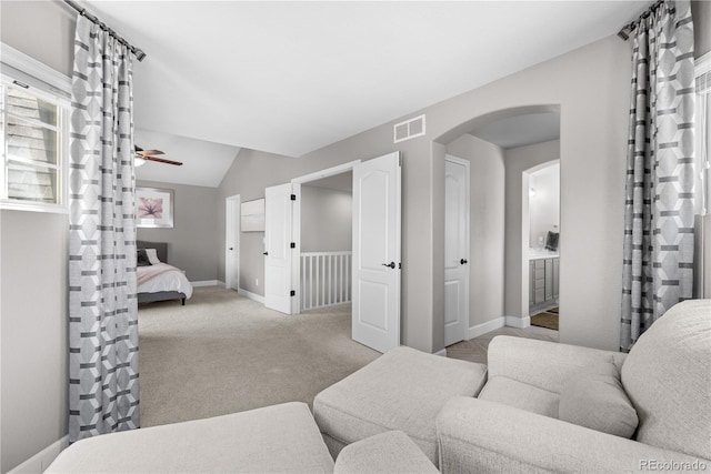 16207 Cadland Ct, Parker, CO 80134 - living room featuring arched walkways, a ceiling fan, lofted ceiling, and carpet floors