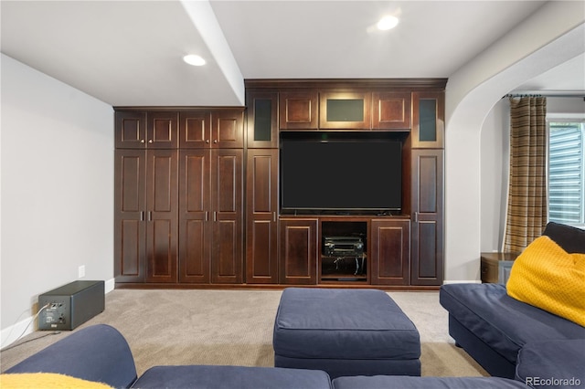 16207 Cadland Ct, Parker, CO 80134 - living room featuring light colored carpet, arched walkways, and recessed lighting