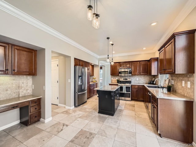 kitchen with tasteful backsplash, baseboards, built in desk, appliances with stainless steel finishes, and a sink