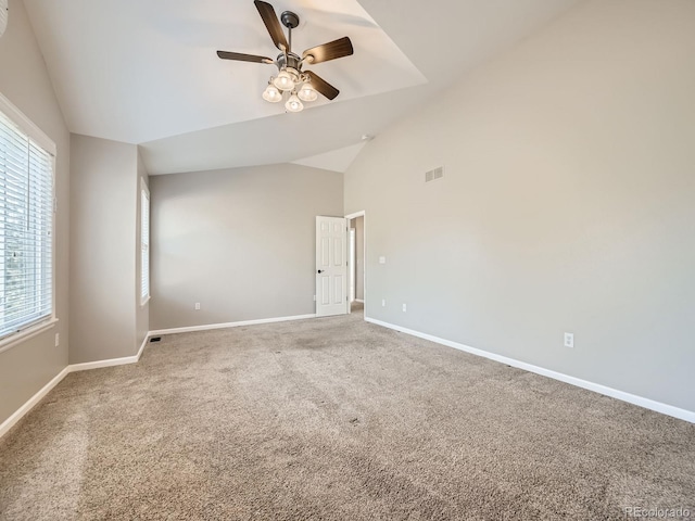 unfurnished room featuring visible vents, high vaulted ceiling, carpet, baseboards, and ceiling fan