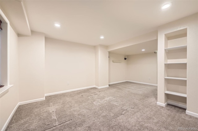 finished basement featuring recessed lighting, baseboards, and carpet