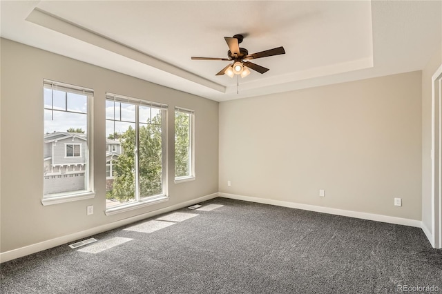 10626 Cherrybrook Cir, Highlands Ranch, CO 80126 - carpeted empty room featuring a raised ceiling and ceiling fan