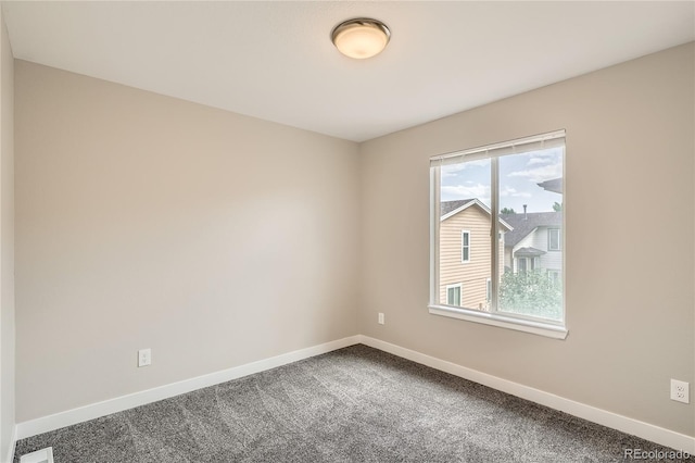 10626 Cherrybrook Cir, Highlands Ranch, CO 80126 - spare room with baseboards and dark carpet