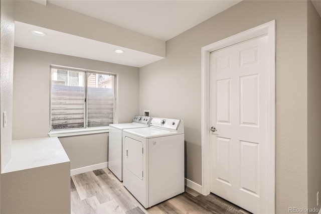 10626 Cherrybrook Cir, Highlands Ranch, CO 80126 - laundry area with independent washer and dryer, light wood-style floors, and recessed lighting