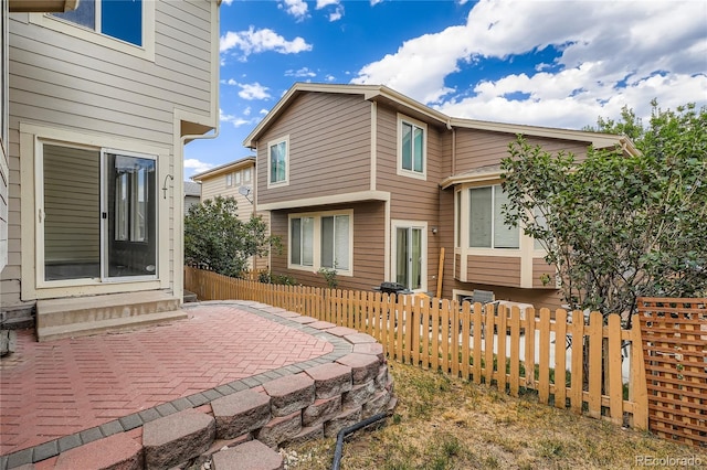 10626 Cherrybrook Cir, Highlands Ranch, CO 80126 - rear view of house with entry steps and a patio area
