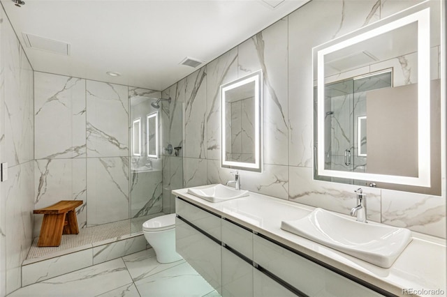 1863 Wazee St Unit 6B, Denver, CO 80202 - bathroom featuring marble look tiles, toilet, a marble finish shower, double vanity, and recessed lighting