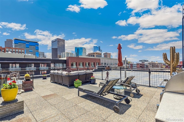 1863 Wazee St Unit 6B, Denver, CO 80202 - view of patio / terrace with a view of skyline, an outdoor living space, and a balcony