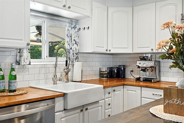 4315 S Elati St, Englewood, CO 80110 - kitchen with wooden counters, stainless steel dishwasher, and white cabinetry