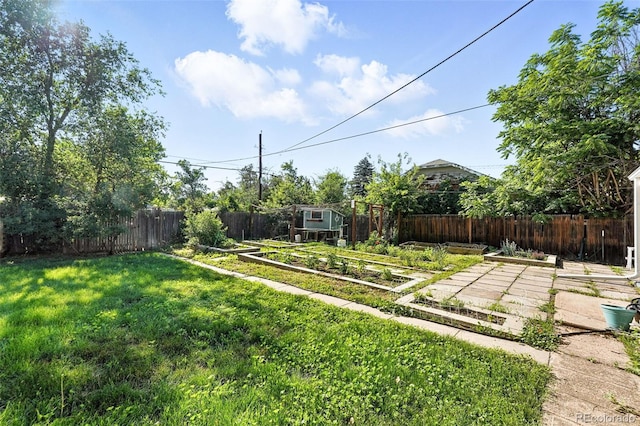 4315 S Elati St, Englewood, CO 80110 - fenced backyard with a vegetable garden