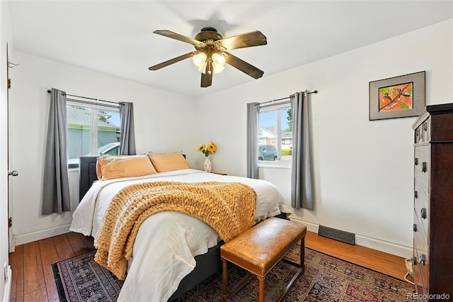 4315 S Elati St, Englewood, CO 80110 - bedroom with multiple windows, hardwood / wood-style floors, and ceiling fan