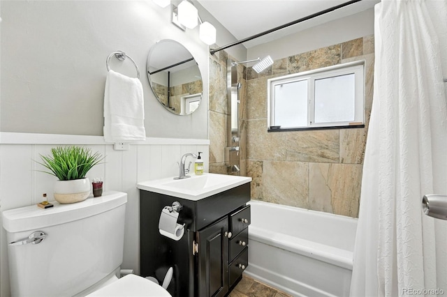 4315 S Elati St, Englewood, CO 80110 - full bath featuring shower / bathtub combination with curtain, vanity, and a wainscoted wall