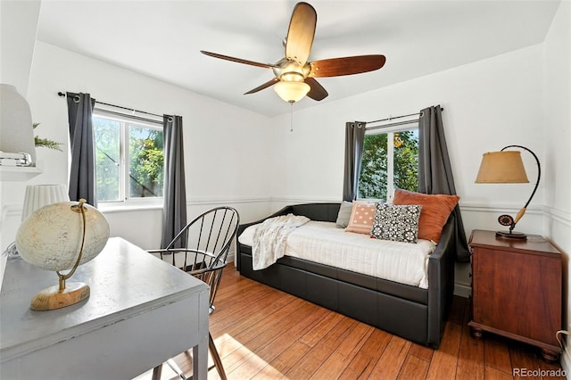 4315 S Elati St, Englewood, CO 80110 - bedroom featuring multiple windows, hardwood / wood-style floors, and a ceiling fan