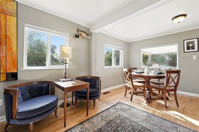 4315 S Elati St, Englewood, CO 80110 - dining area with light wood-style flooring and ornamental molding