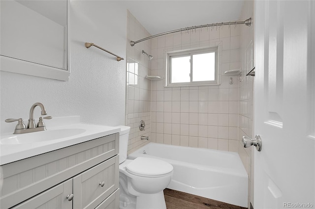 641 E 104th Pl, Northglenn, CO 80233 - full bathroom with vanity, shower / washtub combination, toilet, and wood finished floors