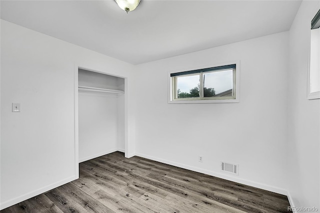 641 E 104th Pl, Northglenn, CO 80233 - unfurnished bedroom featuring wood finished floors, baseboards, and a closet