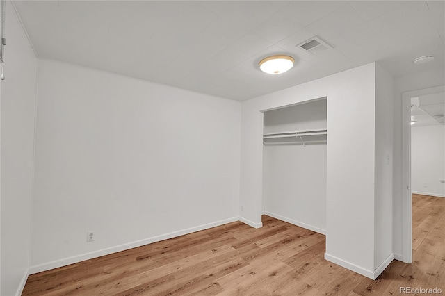 641 E 104th Pl, Northglenn, CO 80233 - unfurnished bedroom with wood finished floors, baseboards, and a closet