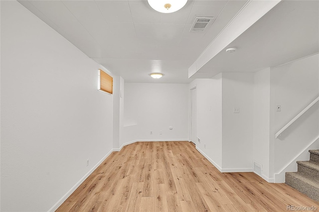 641 E 104th Pl, Northglenn, CO 80233 - finished below grade area with light wood-style flooring, baseboards, and stairs