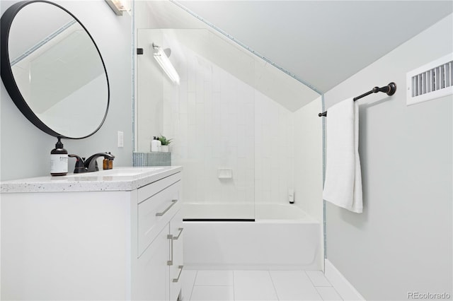 bathroom featuring tiled shower / bath combo, tile patterned floors, and vanity