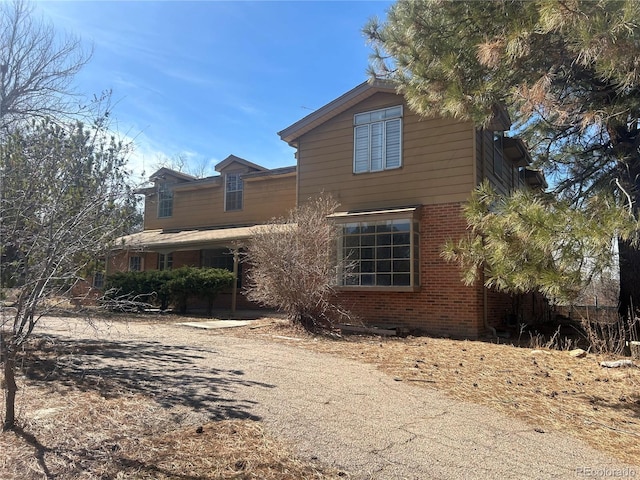 exterior space with brick siding