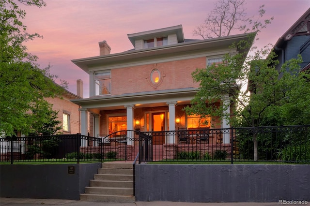 747 N Downing St, Denver, CO 80218 - traditional style home with covered porch, brick siding, and a chimney