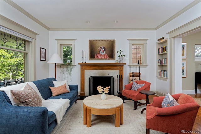 747 N Downing St, Denver, CO 80218 - living area featuring a fireplace, built in features, crown molding, and wood finished floors