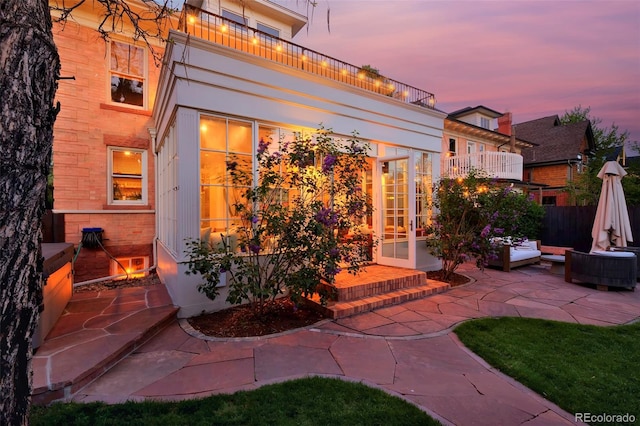 747 N Downing St, Denver, CO 80218 - patio terrace at dusk with outdoor lounge area