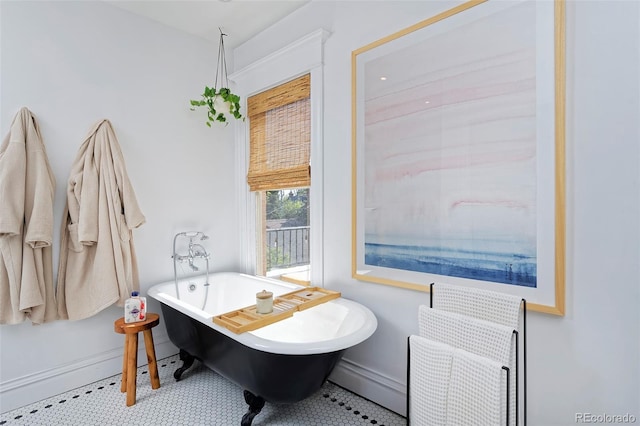 747 N Downing St, Denver, CO 80218 - bathroom featuring a freestanding bath and baseboards