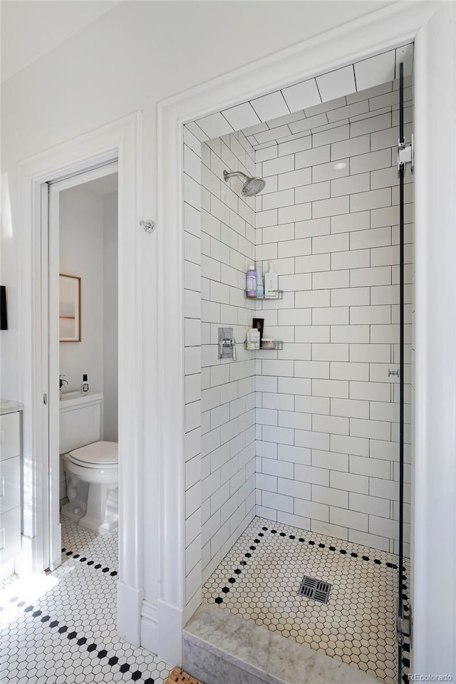 747 N Downing St, Denver, CO 80218 - full bath with a shower stall, toilet, and tile patterned floors