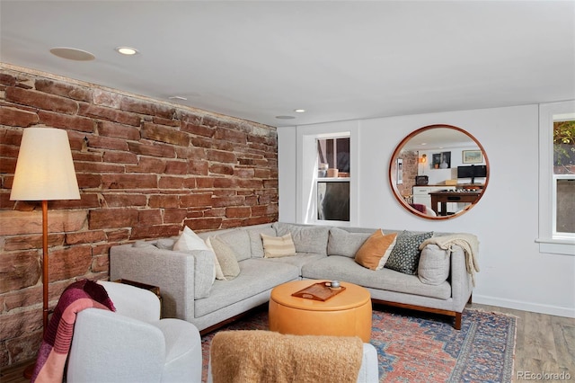 747 N Downing St, Denver, CO 80218 - living area featuring wood finished floors, baseboards, recessed lighting, and brick wall