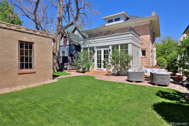 747 N Downing St, Denver, CO 80218 - back of house featuring outdoor lounge area, a yard, a chimney, and entry steps