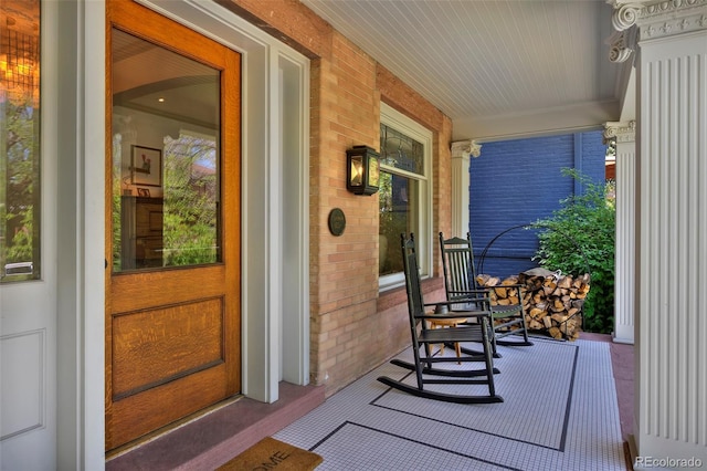 747 N Downing St, Denver, CO 80218 - doorway to property with a porch and brick siding