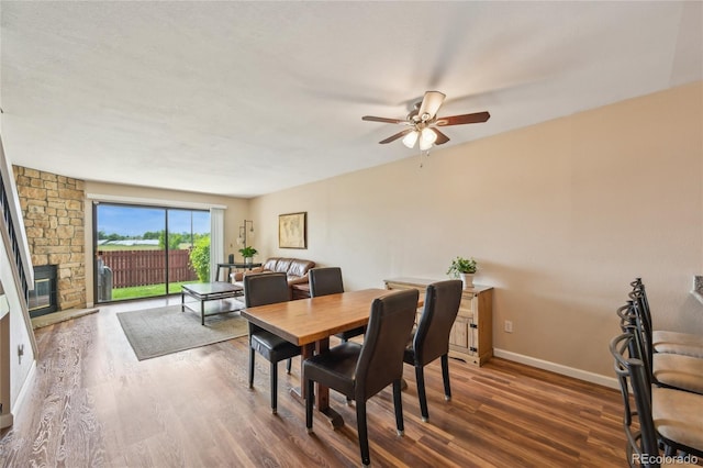 7474 E Arkansas Ave Unit 13-02, Denver, CO 80231 - dining area featuring a ceiling fan, wood finished floors, and baseboards