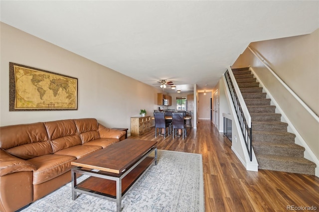 7474 E Arkansas Ave Unit 13-02, Denver, CO 80231 - living area with stairs, dark wood-style flooring, and a ceiling fan